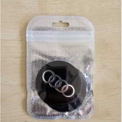 PEGATINA PARA CENTRO DE RUEDA AUDI COLORES NEGRO Y PLATA JUEGO DE 4 PIEZAS TAMAÑO A ELEGIR MEDIDAS EXTERIORES DE 56 Y 65MM